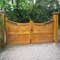 Curved gates with ornate posts